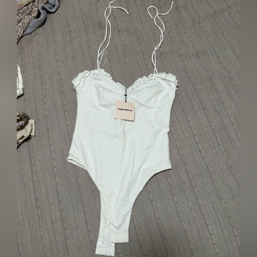 Super down revolve white bodysuit. Never worn.
